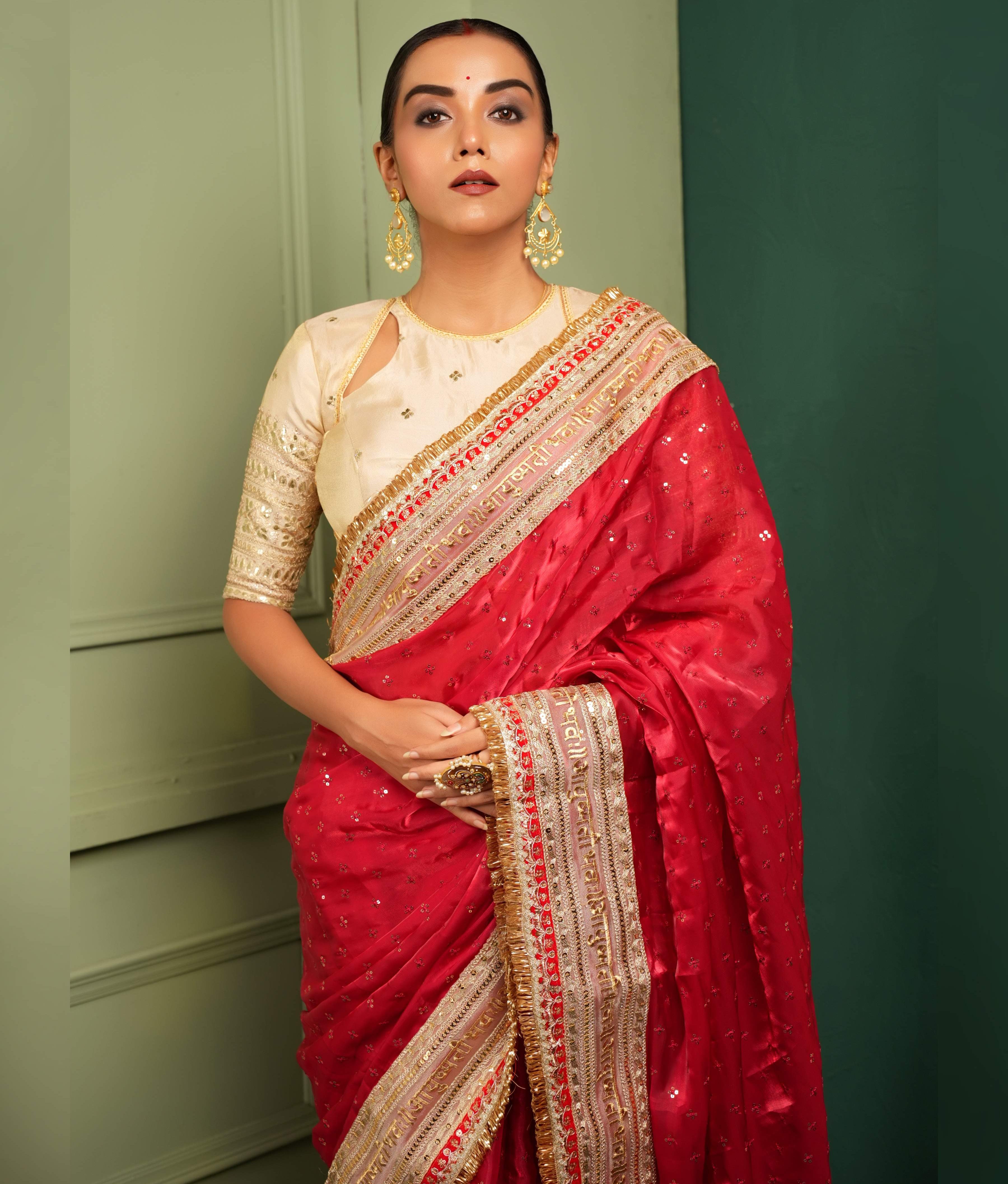 Royal Ruby Queen Saree With The Classic Champagne Blouse