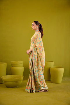 Yellow Crepe Saree With Gold Strapless Blouse