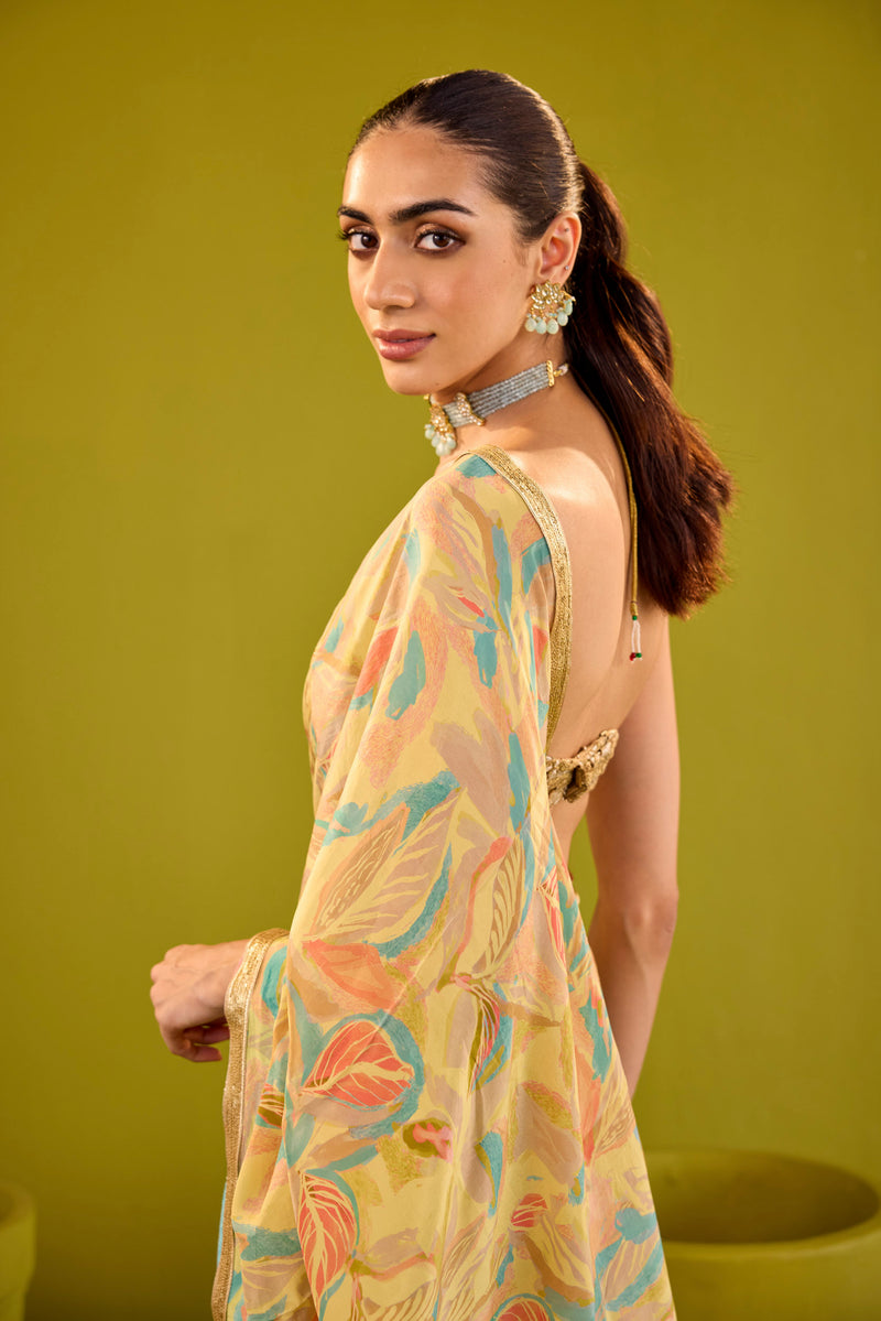 Yellow Crepe Saree With Gold Strapless Blouse