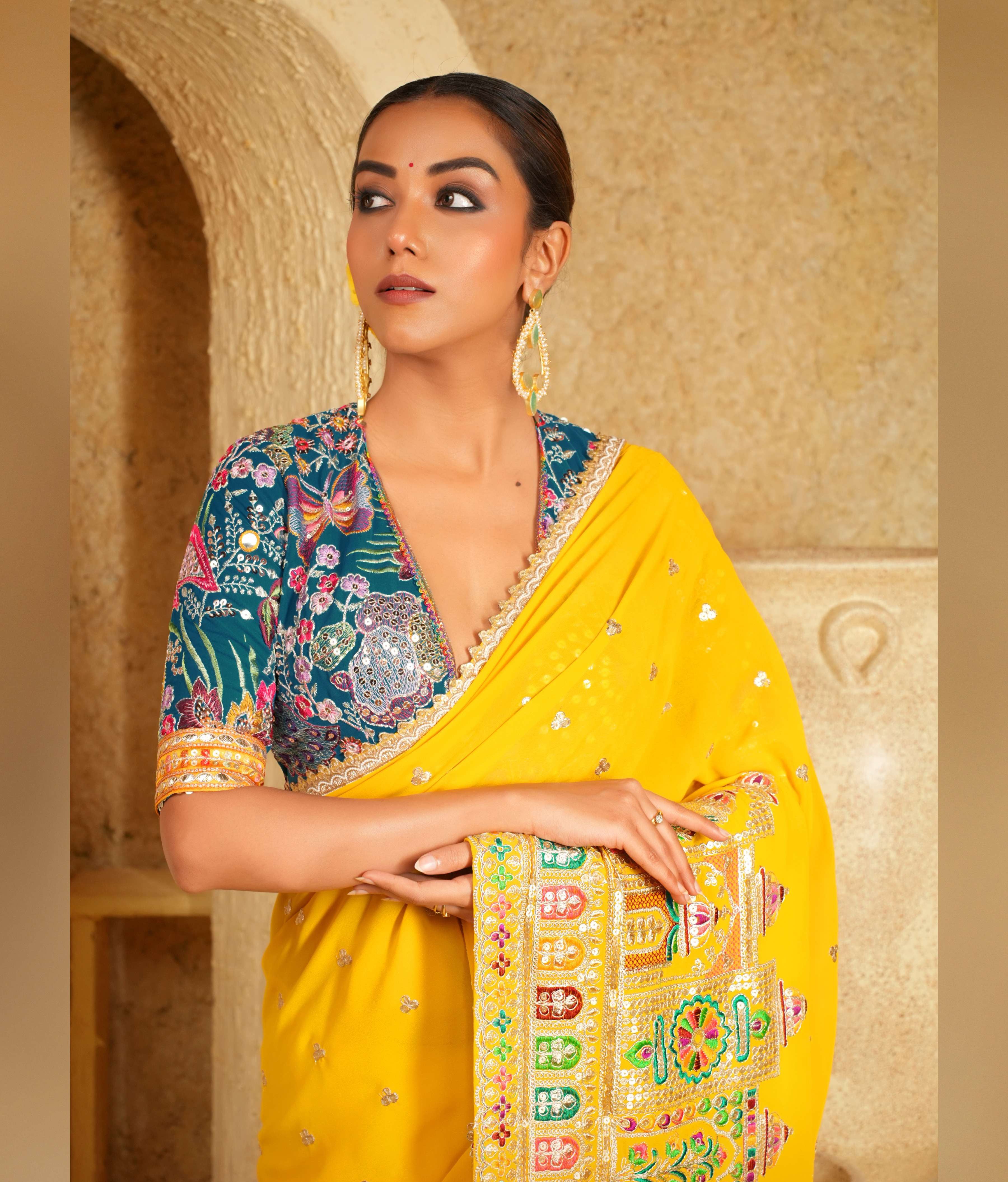 Bright yellow saree with golden border