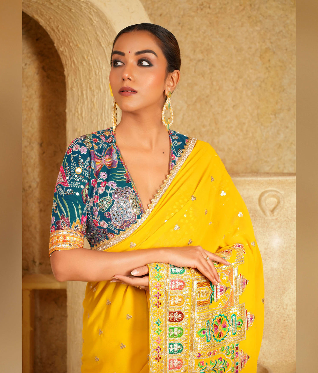 Bright yellow saree with golden border
