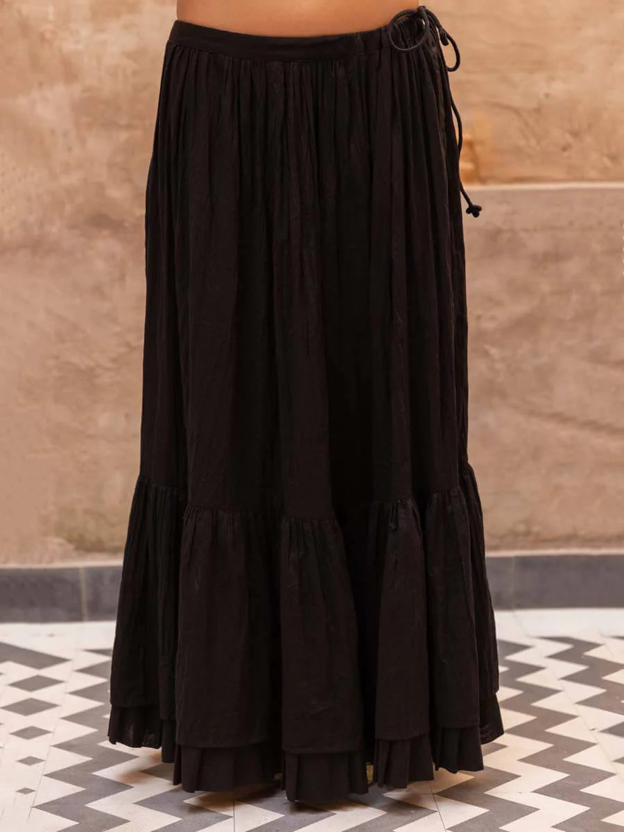 black poncho top and skirt set
