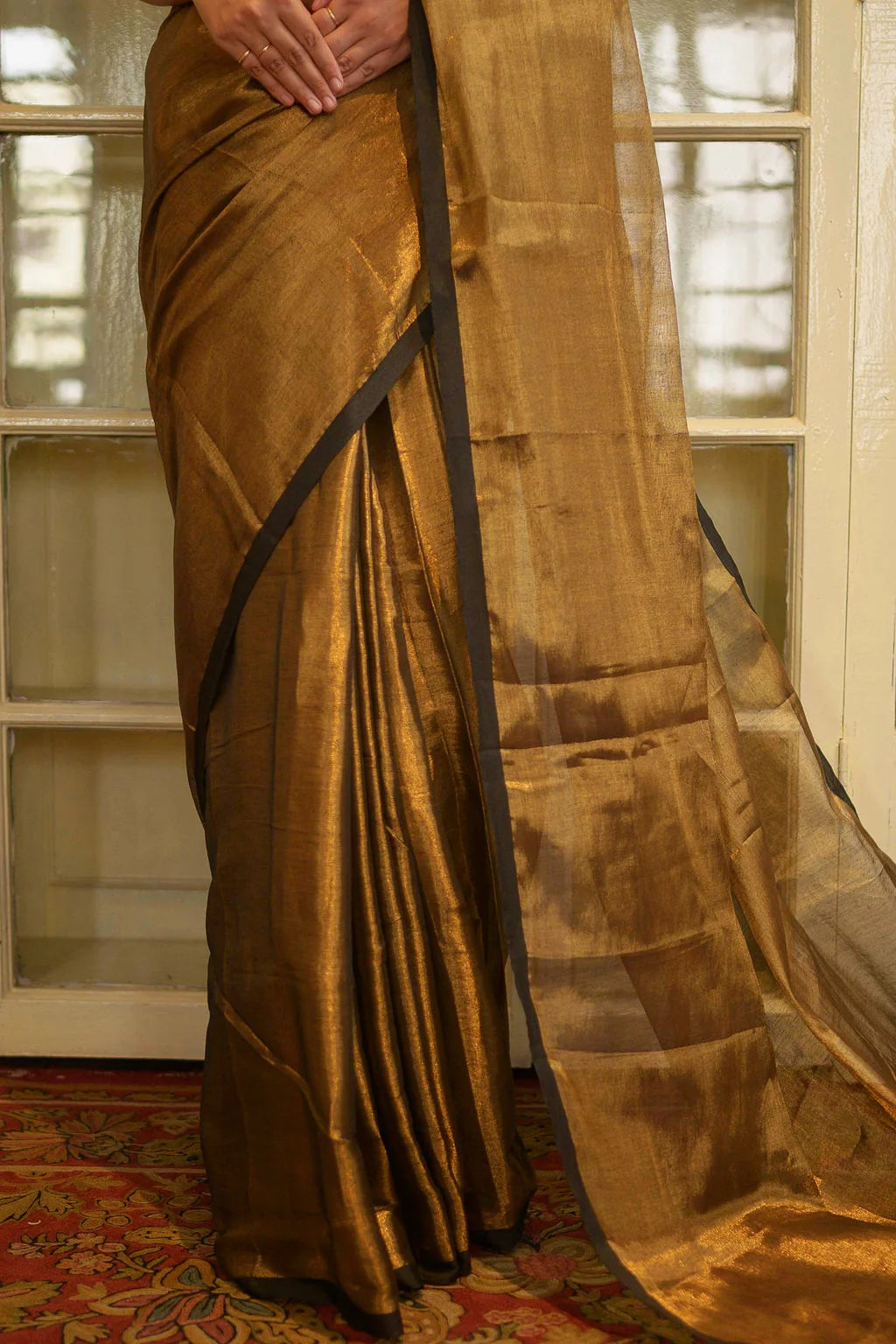 Black and gold saree with tassel work