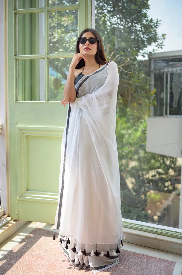 White and black saree with tassels