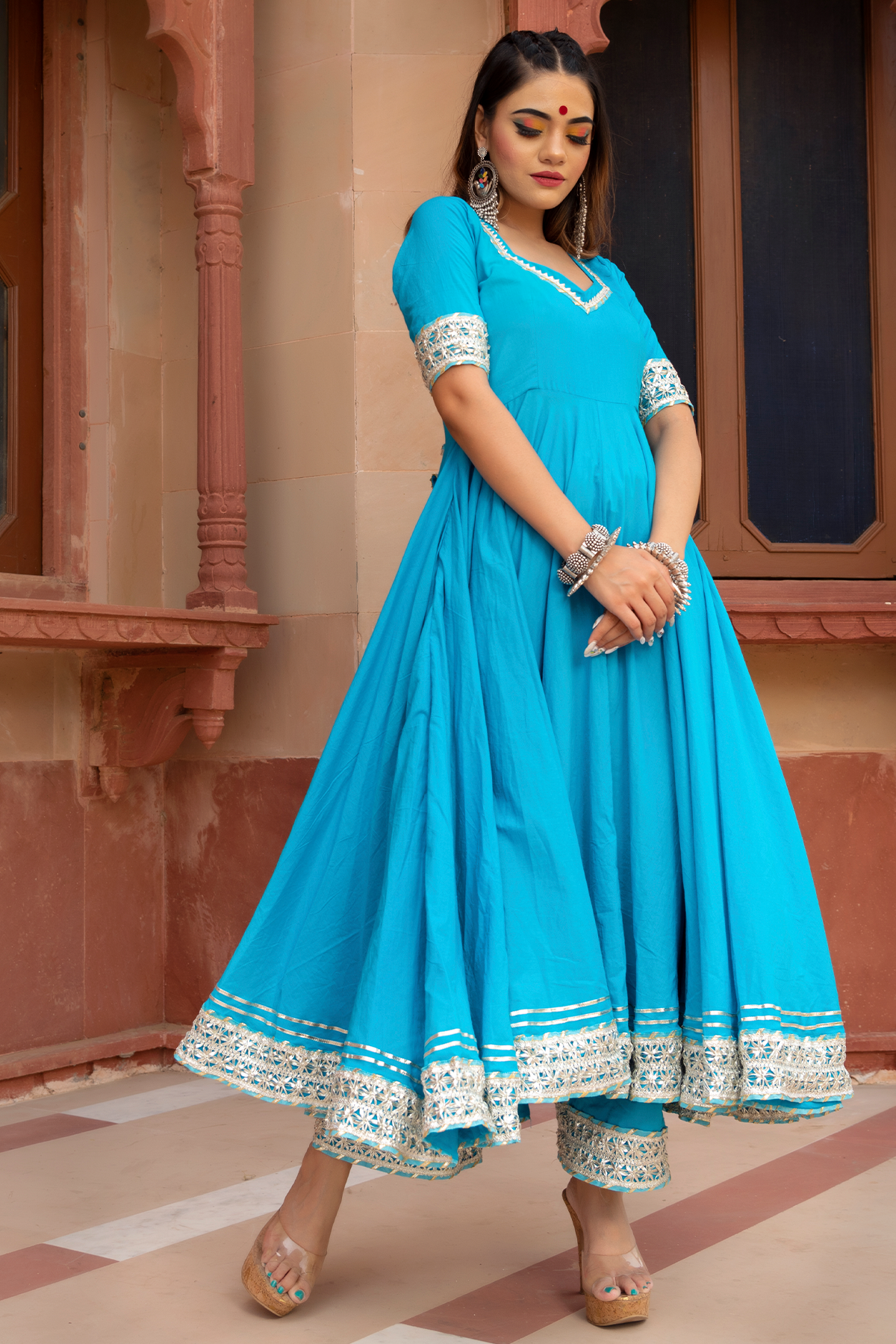 Sky blue anarkali with lace and stonework