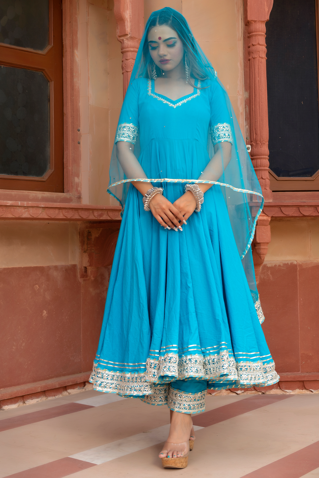 Comfortable anarkali set with lace embellishments