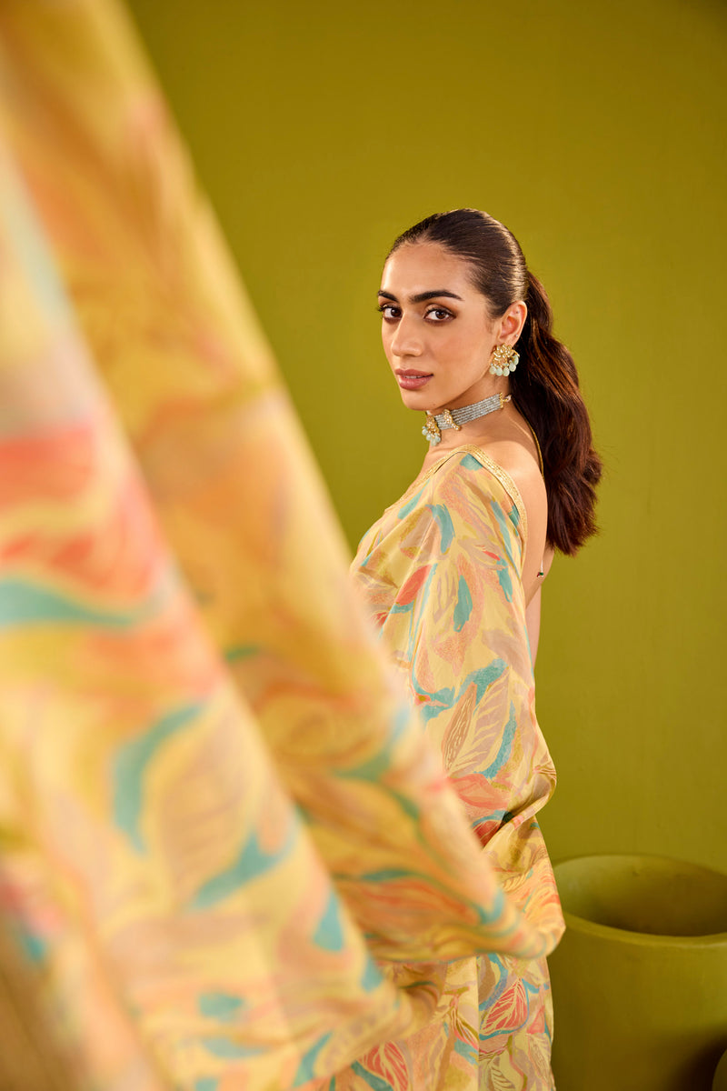 Yellow Crepe Saree With Gold Strapless Blouse