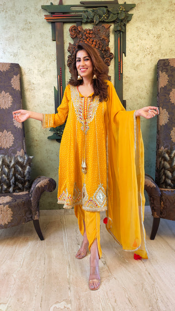 yellow ethnic wear set with tassel dupatta